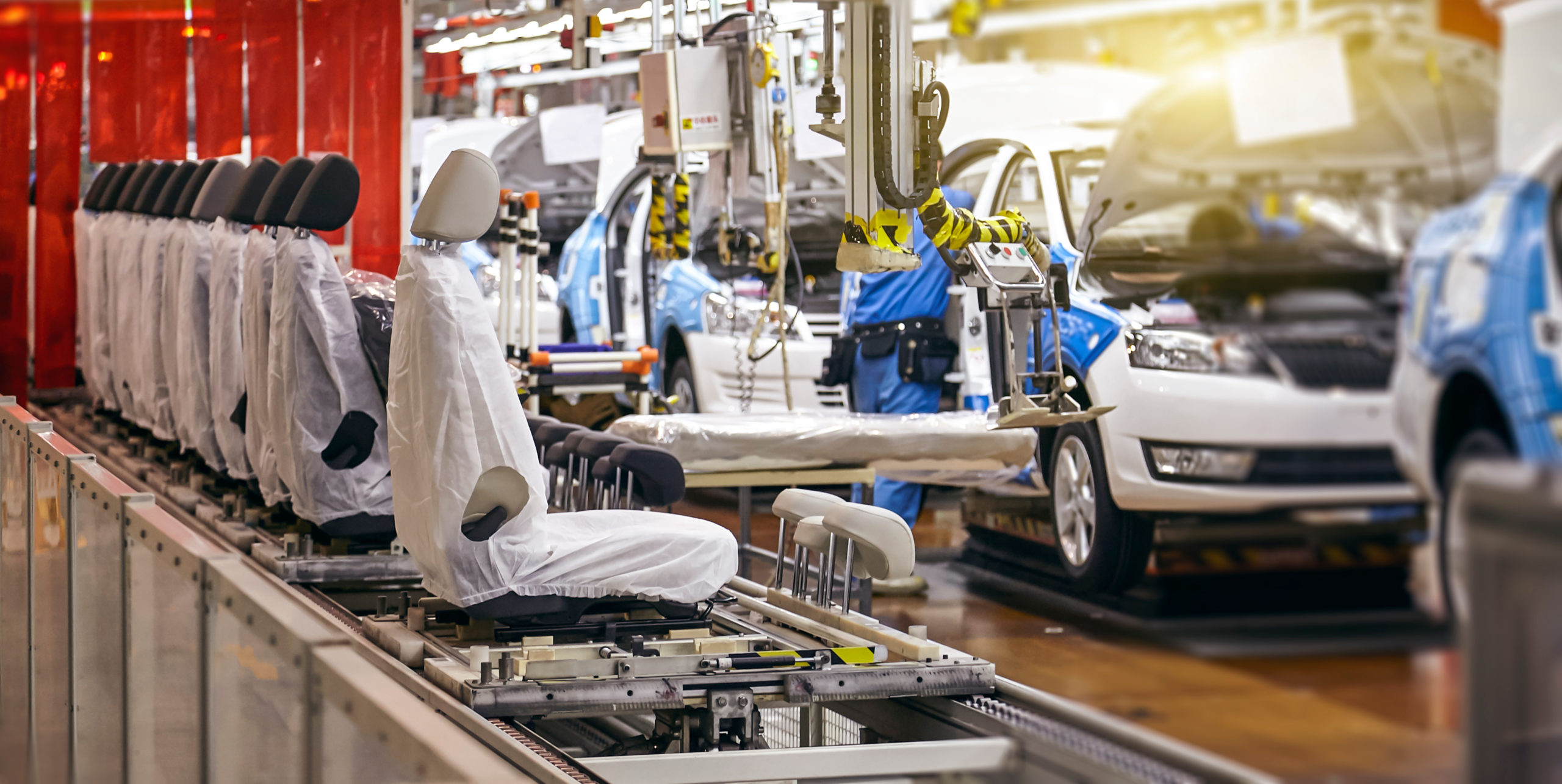 Cars being built in a factory