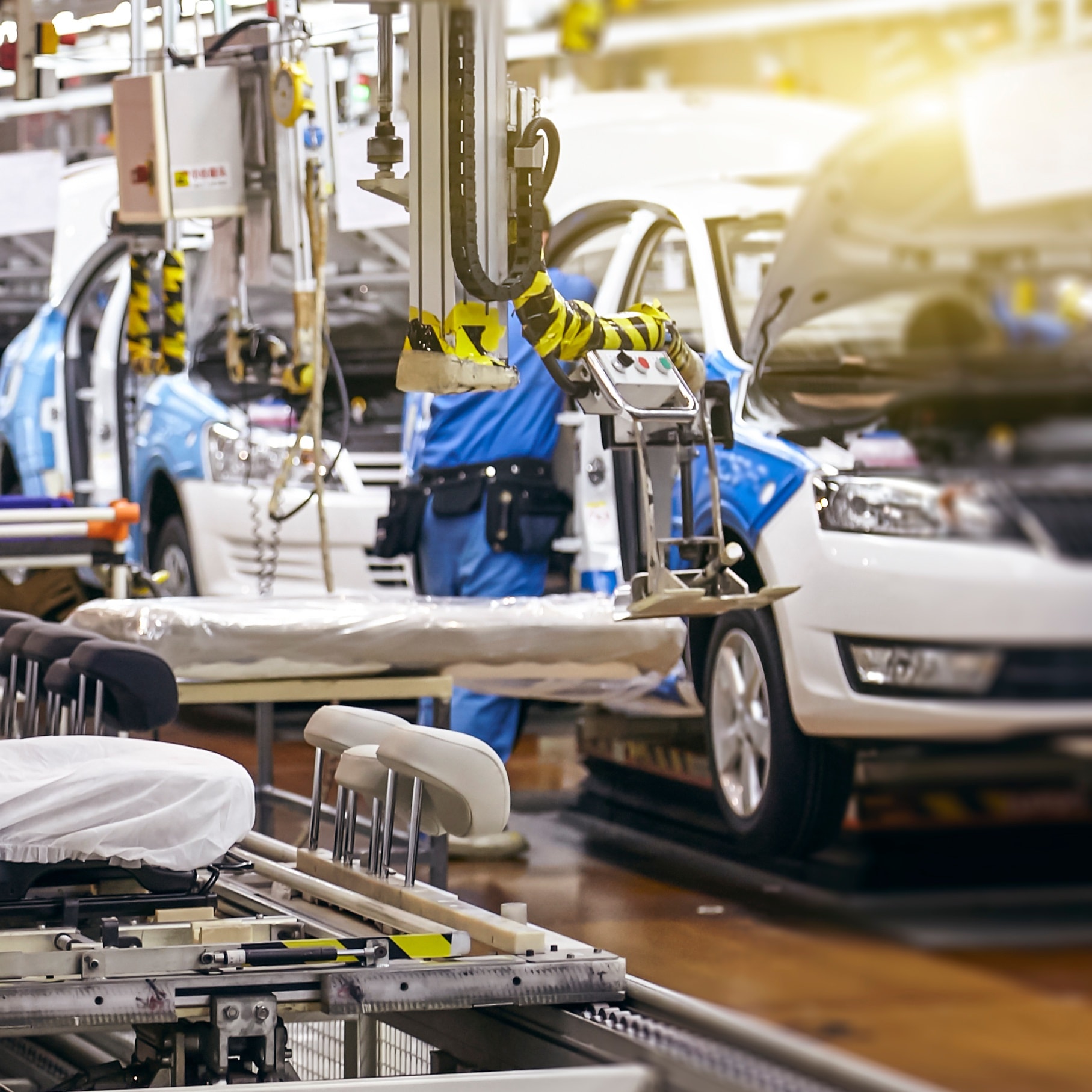 Cars being built in a factory